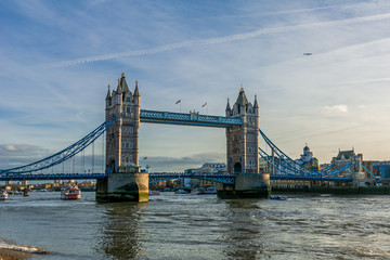 Tower Bridge in London, the UK - one of English symbols. Golden hour time with beautiful sky. 