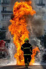 The Firefighters demonstrating fire fighting.