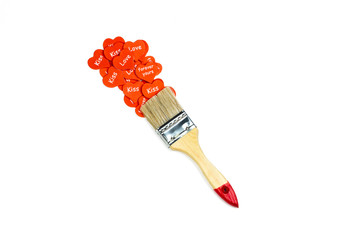 Creative Valentin’s day concept with paint brush and red heart with letter on white background....