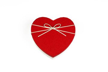 Heart shaped gift box on white background. Valentine’s day greeting card. Red gift box with bow. Part of set.