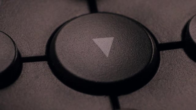 Multimedia control buttons in close-up with soft light.