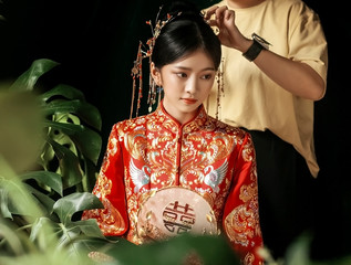 Asian bride doing makeup
