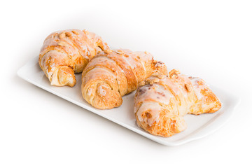Crescent rolls of St. Martin on white ceramic plate.