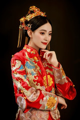 Asian bride wearing chinese wedding costume