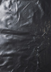 crumpled glossy black polyethylene texture