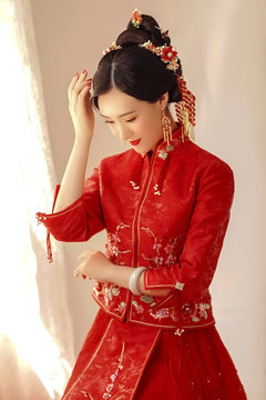 Asian girl in red chinese traditional costume
