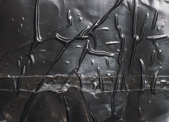 crumpled glossy black polyethylene texture
