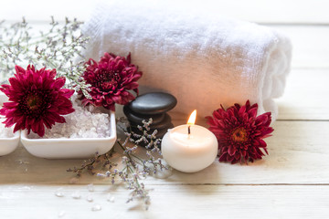 Obraz na płótnie Canvas Thai Spa Treatments aroma therapy salt and sugar scrub and rock massage with red flower with candle for relax time. Thailand. Healthy Concept.