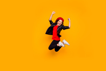 Full length body size view of her she nice attractive cheerful overjoyed brunette wavy-haired girl jumping having fun vacation weekend isolated on bright vivid shine vibrant yellow color background