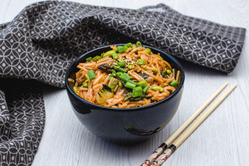 Homemade Pad Thai with Chopstick and a Black Bowl 