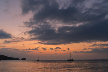 Fototapeta na wymiar Blue sky with cloud bright background at Phuket Thailand. Twilight time orange tone.