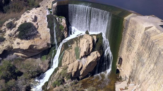 The aerial view of the huge water dam in Cascada Pantano Elche in Spain