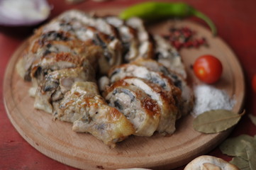  stuffed meatloaf on a round wooden board