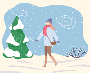 Naklejka na ściany i meble Woman in park or forest. Blizzard and bad weather conditions outdoors. Female character wearing warm clothes strolling on snow outside. Coldness and frost, low temperature vector in flat style