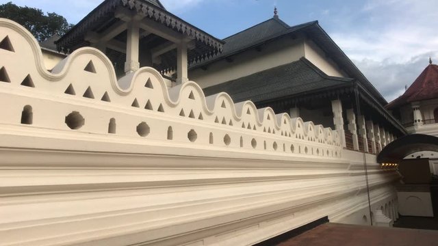 Kandy, Sri Lanka, November 25, 2019, Sri Dalada Maligawa along the main wall of the temple 4K