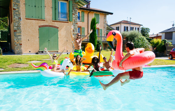 Group Of Friends Having Fun In The Swimming Pool