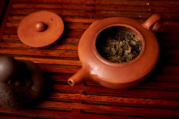 Brewed tea leaves in a teapot.