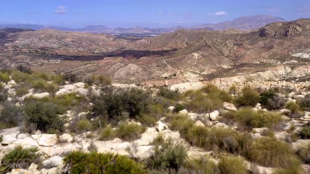 The white sandstones on the rock mountain terrains in Cascada Pantano Elche in Spain