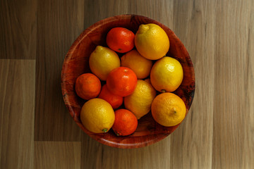 Fototapeta na wymiar citruses in a wooden bowl