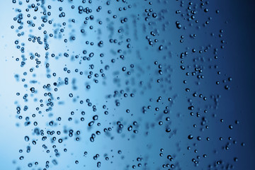 Falling water drops in frozen motion.