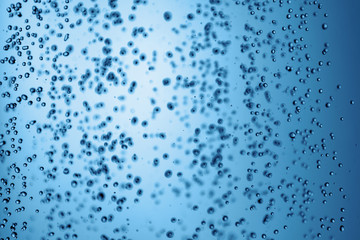 Falling water drops in frozen motion.