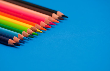 colored pencils with blue classic background