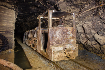 Underground gold mine shaft tunnel drift with electric locomotive