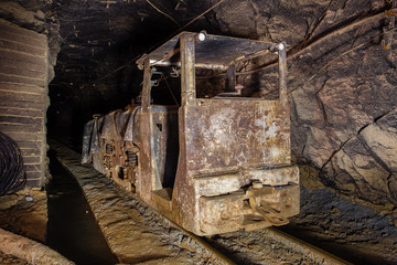 Underground gold mine shaft tunnel drift with electric locomotive