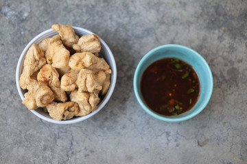 Deep fried fish meatballs crisp with ssweet spicy sauce.