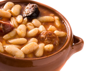 Typical Spanish fabada asturiana isolated on white background	
