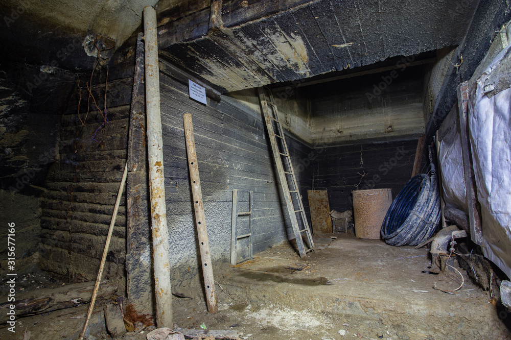 Poster underground gold mine shaft cage with stairs