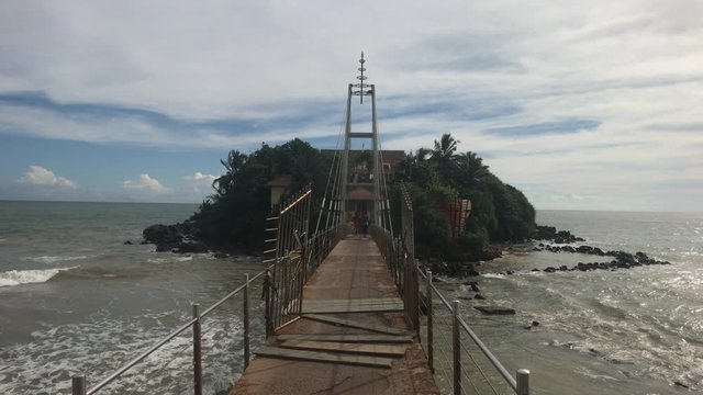 Matara, Sri Lanka, November 25, 2019, Paravi Duwa Temple, beautiful bridge to the island with a temple 4K