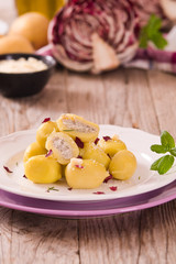 Potato gnocchi stuffed with radicchio and ricotta.