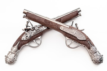 Firearms dating to the american revolution and antique collectables concept with ornate old...