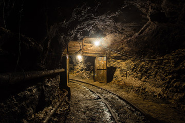 Underground gold mine shaft tunnel drift turn with rails