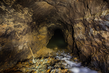 Underground gold mine settler pond waterfall