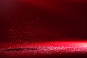 Red blurred abstract shiny valentines day background, festive glitter sparkles