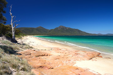 View over turquoise waters of Hazard Beach (next to Wineglass Bay), Freycinet National Park, Tasmania, Australia