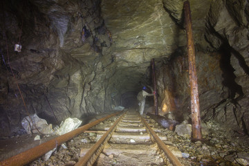Underground gold mine shaft tunnel drift with rails