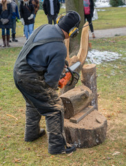 unknown worker is using a chainsaw with skill