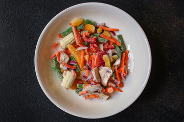 frozen vegetables mix salad (onions, corn, peppers, paprika, mushrooms, asparagus beans, carrots and others, ketogenic diet) menu concept. food background. top view. copy space