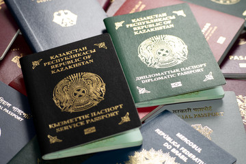 Different passports of Kazakhstan against the background of various passports of the countries of the world.