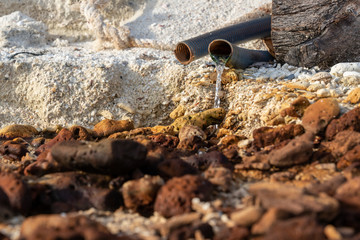 sewage and waste water drain on sand beach