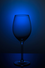 wine glass on a blue background. dishes on the clearance on a blue background