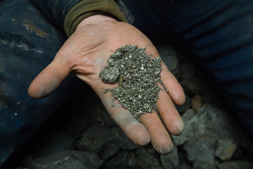 Gold ore pyrite specimen in miners hand