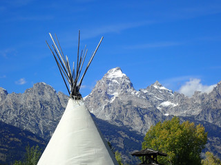Tipi with snow capped mountains in the background © Allen Penton