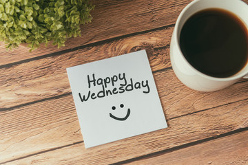 Happy Wednesday with smile greeting on paper note with cup of coffee - obrazy, fototapety, plakaty