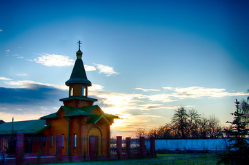 Orthodox wooden church at dawn. Temple of the Blessed Matrona of Moscow Soligorsk