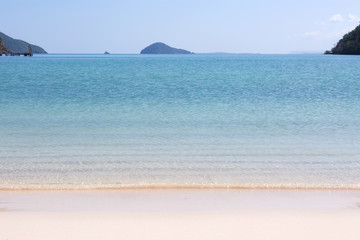 Blue sea waves summer background. Sand beach