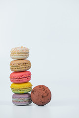 Assorted colorful macaroons on light background, copy space